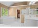 Bright main bathroom featuring a soaking tub, shower, and large vanity with dual sinks at 4635 Rutledge Dr, Snellville, GA 30039