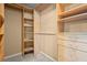 Organized walk-in closet with custom shelving and drawers for efficient storage solutions at 4635 Rutledge Dr, Snellville, GA 30039
