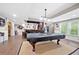 Finished basement with a billiard table, wet bar, and a cozy entertainment area for Gathering and friends at 4877 Registry Nw Ln, Kennesaw, GA 30152