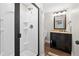 Modern bathroom featuring a stand-up shower, updated vanity and fixtures, and great lighting at 4877 Registry Nw Ln, Kennesaw, GA 30152