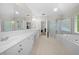 Bathroom featuring double sinks, a soaking tub, and a glass-enclosed shower at 4877 Registry Nw Ln, Kennesaw, GA 30152