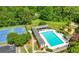 Scenic aerial view of a community pool, playground, tennis courts, and manicured green spaces at 4877 Registry Nw Ln, Kennesaw, GA 30152