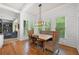Charming dining area featuring a wooden table, woven chairs, and shiplap walls at 4877 Registry Nw Ln, Kennesaw, GA 30152