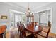 Formal dining room featuring hardwood floors, crown molding, and elegant chandelier at 4877 Registry Nw Ln, Kennesaw, GA 30152