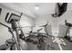 Home gym with mirrors and rubber flooring, equipped with treadmill, elliptical, and weight training equipment at 4877 Registry Nw Ln, Kennesaw, GA 30152