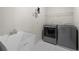 Laundry room featuring a sink, modern washer and dryer, and tile floor at 4877 Registry Nw Ln, Kennesaw, GA 30152