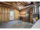 Unfinished basement with visible utilities and a door to the outside at 1551 Pharrs Rd., Snellville, GA 30078