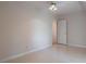 Large bedroom with neutral walls and a ceiling fan at 1551 Pharrs Rd., Snellville, GA 30078