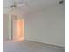 A spacious bedroom featuring neutral walls, carpet, and a ceiling fan at 1551 Pharrs Rd., Snellville, GA 30078