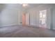 Spacious bedroom featuring a ceiling fan and an open doorway to the bathroom at 1551 Pharrs Rd., Snellville, GA 30078