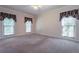 Bedroom featuring carpet flooring and large windows at 1551 Pharrs Rd., Snellville, GA 30078