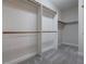 A spacious walk-in closet with adjustable shelving and ample storage space at 1551 Pharrs Rd., Snellville, GA 30078