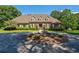 Beautiful brick home featuring manicured landscaping and circular driveway with a fountain at 1551 Pharrs Rd., Snellville, GA 30078