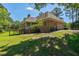 Brick home featuring a two-car garage, a screened porch and a wooden deck offering a seamless blend of indoor-outdoor living at 1551 Pharrs Rd., Snellville, GA 30078