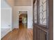 Inviting home foyer with hardwood floors and views to living room with fireplace at 1551 Pharrs Rd., Snellville, GA 30078