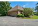 Image of the home's exterior with an attached two-car garage and manicured landscaping enhancing curb appeal at 1551 Pharrs Rd., Snellville, GA 30078