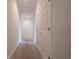 Hallway with carpet flooring and neutral wall paint at 1551 Pharrs Rd., Snellville, GA 30078