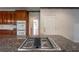 Kitchen island with cooktop and granite counter top at 1551 Pharrs Rd., Snellville, GA 30078