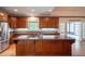 Kitchen with stainless steel appliances, granite countertops, and a large central island at 1551 Pharrs Rd., Snellville, GA 30078
