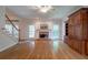 Bright living room featuring hardwood floors and a brick fireplace at 1551 Pharrs Rd., Snellville, GA 30078