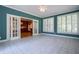 Bright sun room leading to the kitchen with windows offering plenty of natural light at 1551 Pharrs Rd., Snellville, GA 30078