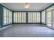 Bright sun room with large windows offering plenty of natural light at 1551 Pharrs Rd., Snellville, GA 30078