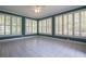 Bright sun room with large windows offering plenty of natural light at 1551 Pharrs Rd., Snellville, GA 30078