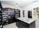 Custom walk-in closet with shelving, drawers, storage, with large center island at 2015 Shaudi Ln, Atlanta, GA 30345