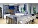 The open-concept kitchen features marble counters, stainless appliances, and breakfast bar seating at 2015 Shaudi Ln, Atlanta, GA 30345