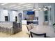 Bright kitchen with stainless appliances, marble counters, and modern lighting fixtures in an open-concept space at 2015 Shaudi Ln, Atlanta, GA 30345