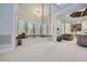 Spacious room with light carpet, a swing by the window, recessed lighting, and ample space for activities at 2015 Shaudi Ln, Atlanta, GA 30345