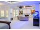Entertaining area boasts a large screen, projector, custom paint design, and unique fish tank at 2015 Shaudi Ln, Atlanta, GA 30345