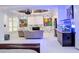 Entertaining area boasts a large screen, projector, custom paint design, wet bar, and unique fish tank at 2015 Shaudi Ln, Atlanta, GA 30345