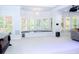 Spacious room with light carpet, window seating, recessed lighting, and ample space for activities at 2015 Shaudi Ln, Atlanta, GA 30345