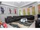 Open living room featuring an oversized sectional sofa, custom rug, and large windows offering plenty of natural light at 2015 Shaudi Ln, Atlanta, GA 30345