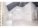 Expansive shower with multiple shower heads, bench seating, and sleek marble finishes at 2015 Shaudi Ln, Atlanta, GA 30345