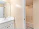 Cozy bathroom with tub and shower combination, vanity, and ample lighting at 2949 Lake Spivey Pkwy, Jonesboro, GA 30236
