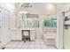 Spacious bathroom featuring a vanity, tub, and large mirrors at 2949 Lake Spivey Pkwy, Jonesboro, GA 30236