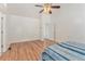 Bright bedroom with hardwood floors, vaulted ceilings, and a ceiling fan at 2949 Lake Spivey Pkwy, Jonesboro, GA 30236