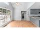 Sunlit dining area with hardwood floors and views of the outdoor patio enhancing the appeal of the home's open layout at 2949 Lake Spivey Pkwy, Jonesboro, GA 30236