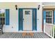 Charming front door with blue accents, sidelights, and a welcoming mat at 2949 Lake Spivey Pkwy, Jonesboro, GA 30236