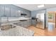 Modern kitchen with stainless steel appliances, granite countertops, ample cabinet space, and hardwood floors adding elegance at 2949 Lake Spivey Pkwy, Jonesboro, GA 30236