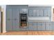 Kitchen boasting modern gray cabinets, stainless steel double oven, granite countertops, and hardwood floors for a stylish design at 2949 Lake Spivey Pkwy, Jonesboro, GA 30236
