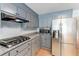 Well-equipped kitchen featuring stainless steel appliances, granite countertops, and plenty of storage space with modern cabinetry at 2949 Lake Spivey Pkwy, Jonesboro, GA 30236