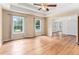 Spacious living room with hardwood floors, large windows, and neutral walls offering a bright and inviting atmosphere at 2949 Lake Spivey Pkwy, Jonesboro, GA 30236