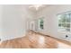Bright living room with wood floors, high ceilings, ceiling fan, and double doors to the exterior at 2949 Lake Spivey Pkwy, Jonesboro, GA 30236