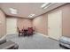 Carpeted basement area featuring seating, a game table, and ample recessed lighting at 3635 Norwich Dr, Tucker, GA 30084