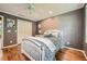 Comfortable bedroom featuring hardwood floors, ceiling fan, and closet at 3635 Norwich Dr, Tucker, GA 30084