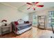 Bright bedroom with daybed, hardwood floors, and ample natural light from large windows at 3635 Norwich Dr, Tucker, GA 30084