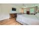 Bright bedroom boasts hardwood floors, TV, ceiling fan, and natural light at 3635 Norwich Dr, Tucker, GA 30084